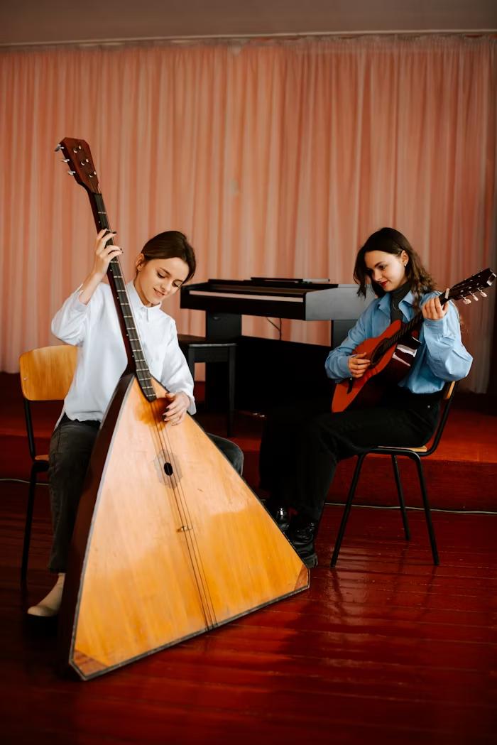 Young musicians collaborating with balalaika and guitar