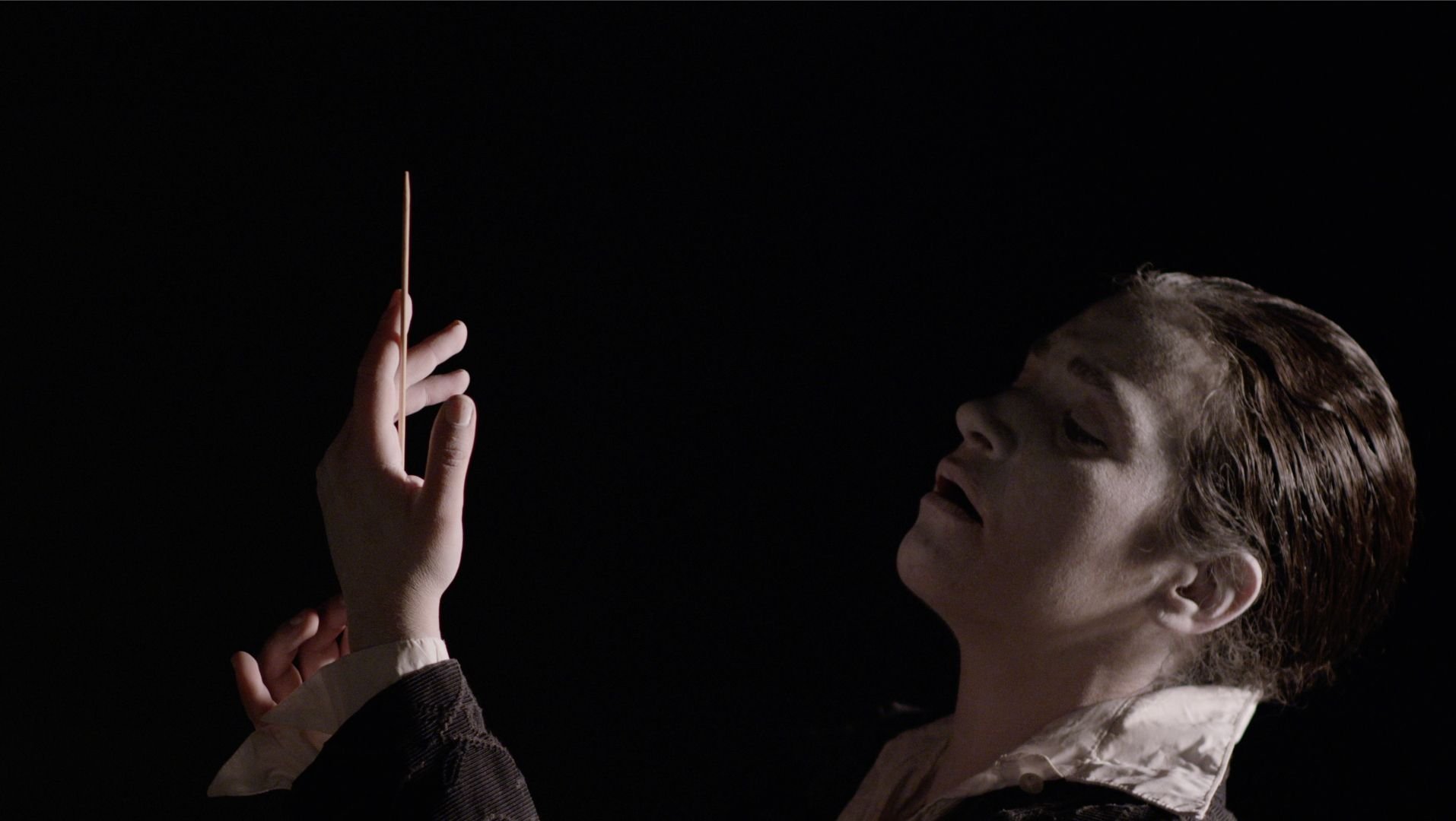 Black cellist performing